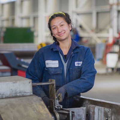 A woman working with a machinery